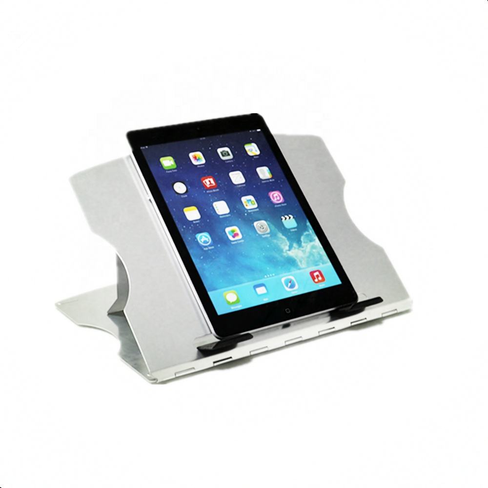 Aluminum laptop cooling stand with MacBook on ventilated surface